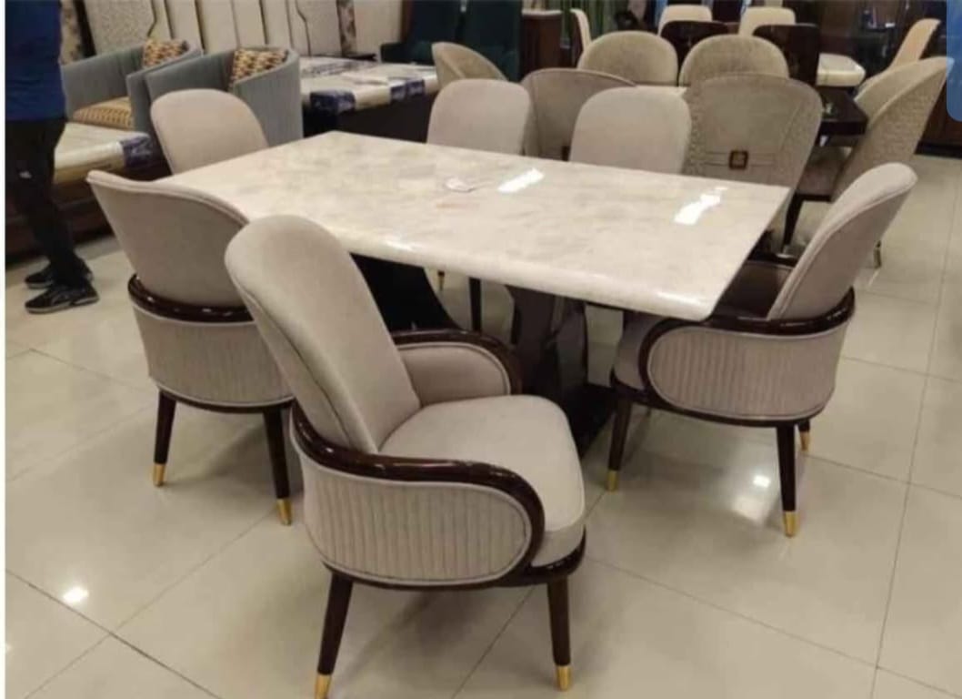 Custom dining furniture with beige chairs and marble top