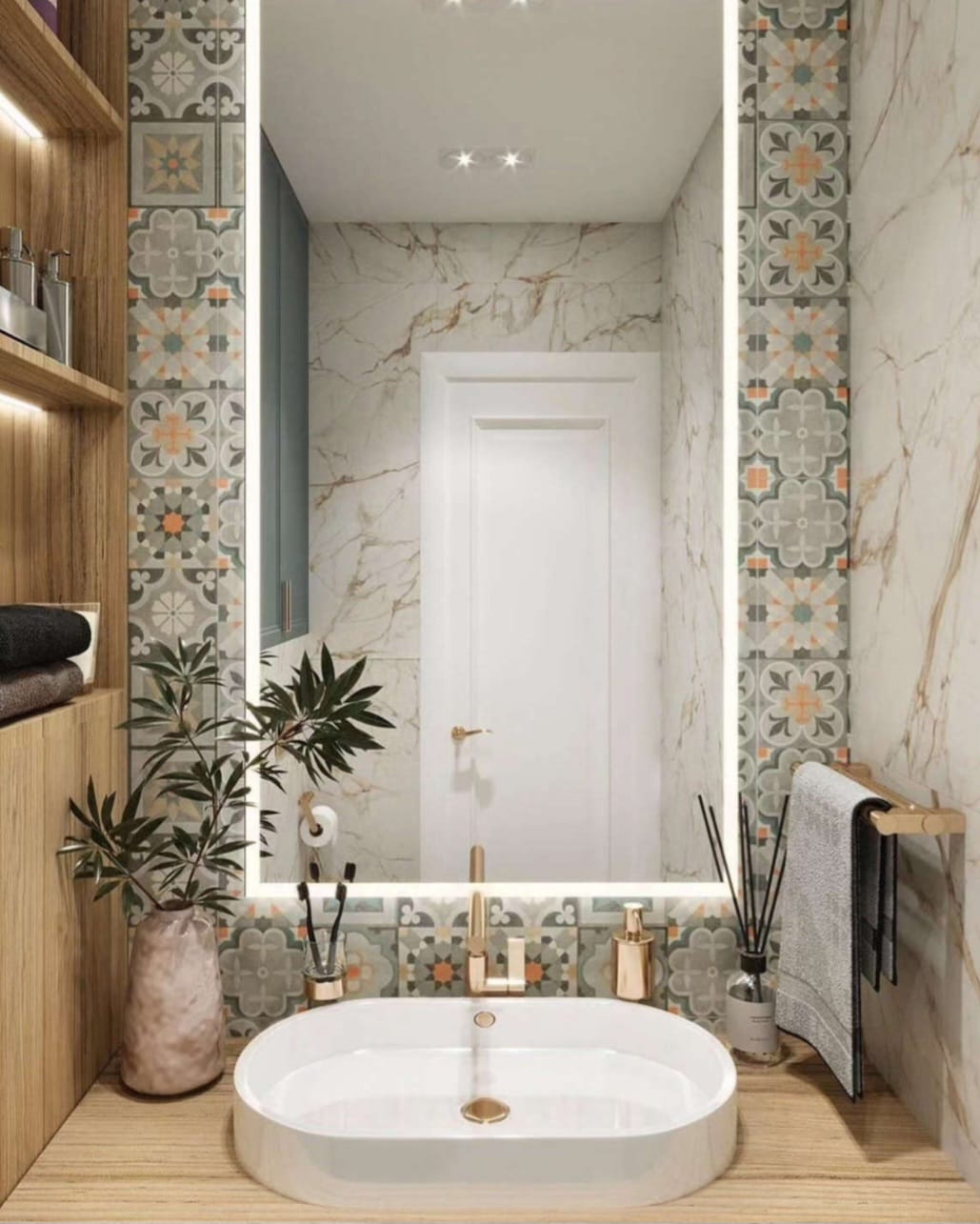 Vanity with backlit mirror and gold faucet